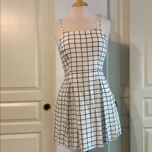 White and black pleated skater dress